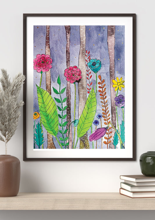 A framed art print featuring a colorful watercolor illustration of wildflowers and birch trees, styled on a light wood shelf next to a brown vase and books.